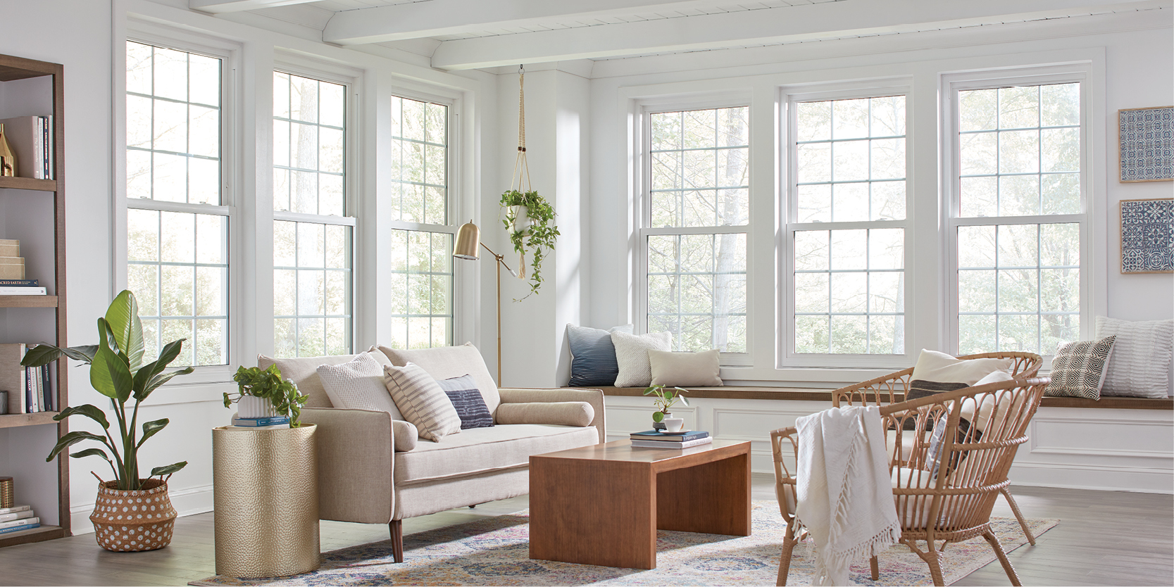 Regency white double hung windows with colonial grid pattern installed in a sunroom